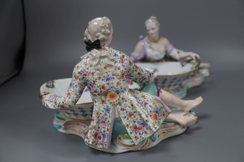 A pair of 19th century Meissen figural baskets, one numbered 2863, the other 2858